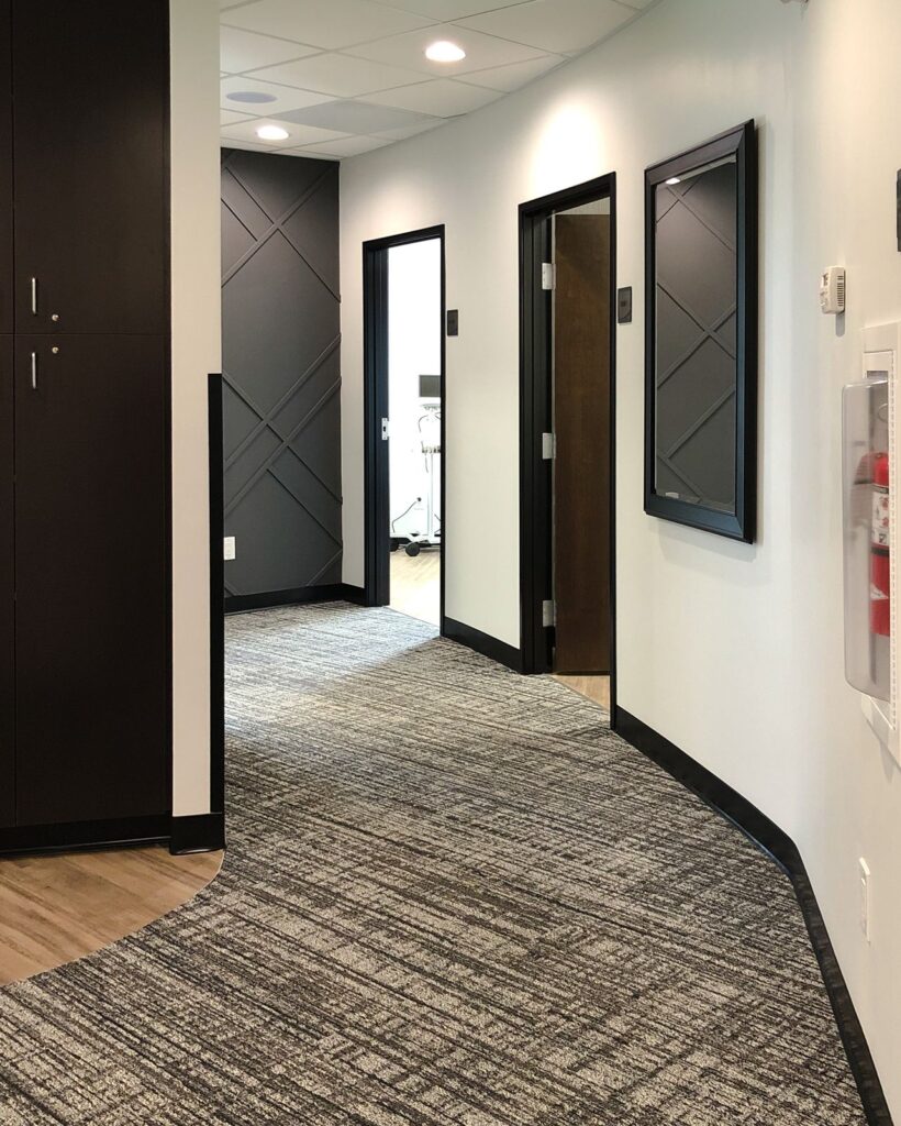 Curved hallway featuring medical office interior design and commercial renovation by Indianapolis architecture team.