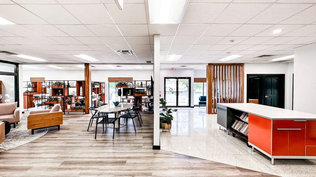 Art consulting studio with large windows, wood accents, and modern decor.