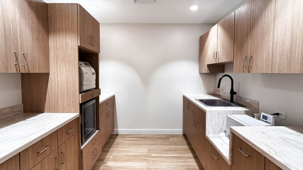 Sterilization area featuring built-in cabinetry and durable surface materials.