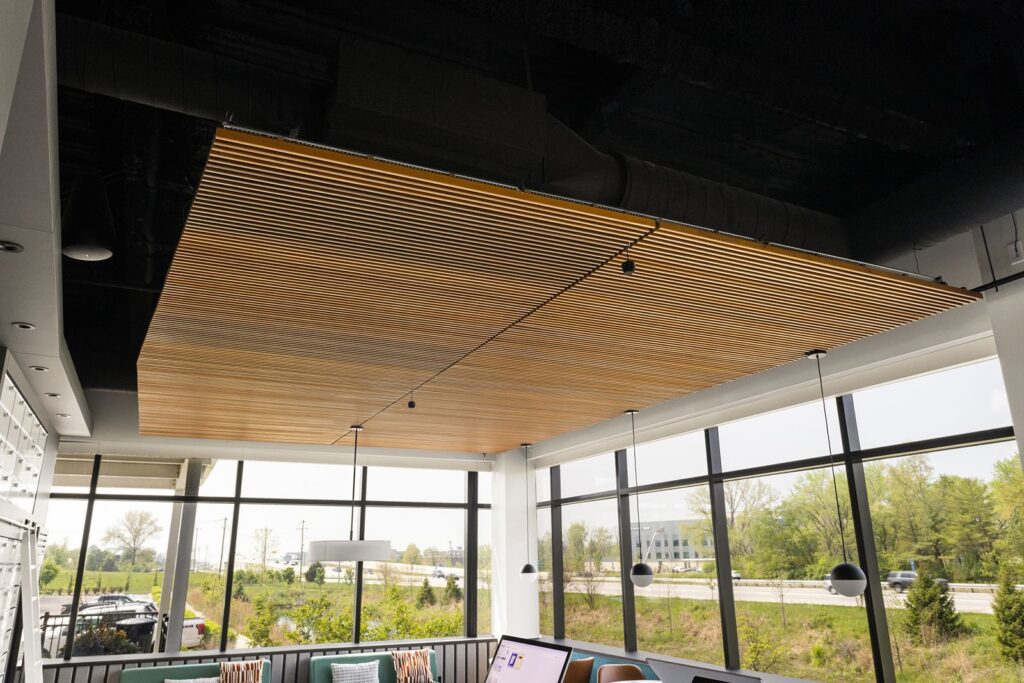 Media wall with mounted screens and built-in cabinetry for design presentations and product demos.
