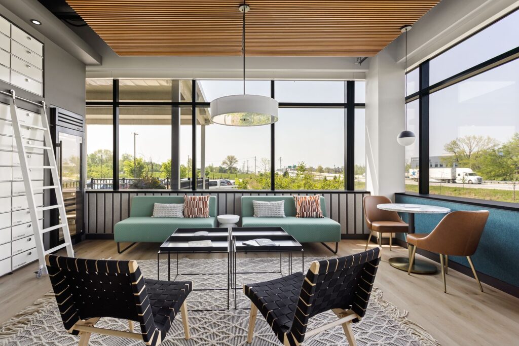 Design center seating area showcasing modern furniture, layered textures, and natural lighting.