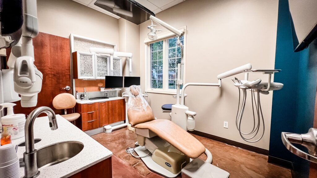 Exam room with panoramic imaging equipment and cabinetry.