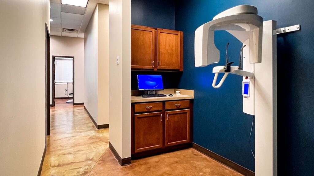 Hallway view connecting exam rooms and sterilization area.
