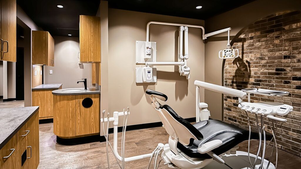 Clinical room with built-in cabinetry and dental office interior design planning.