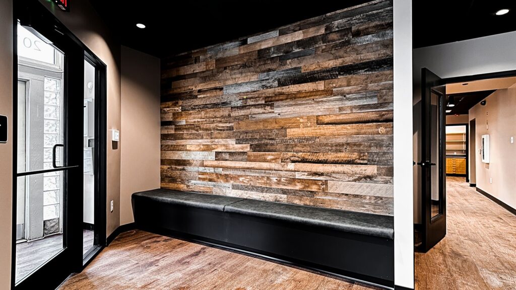 Waiting area and entryway showcasing warm wood tones and contemporary healthcare interior design.