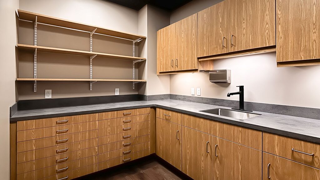 Private restroom interior designed with matte tile and ambient lighting for patient comfort.