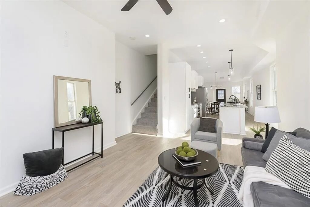 Living room with staircase view and modern interior finishes.