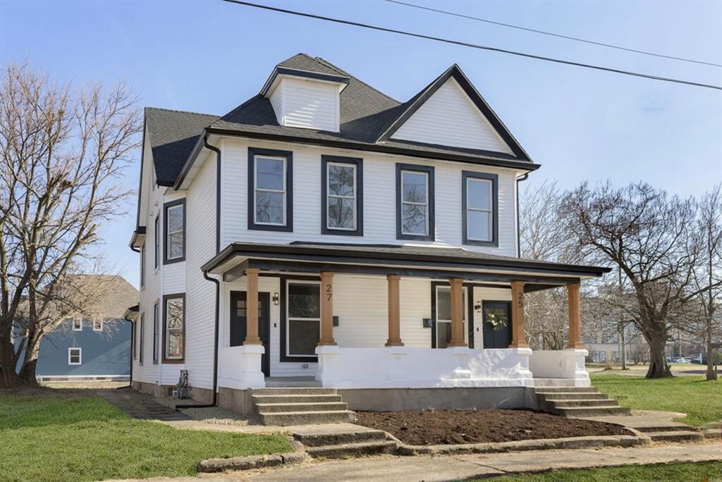 Transitional kitchen featuring mix of white and gray cabinetry with subway backsplash.