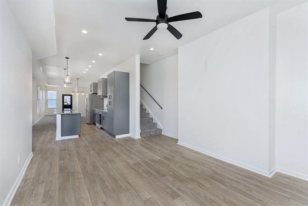 Entryway and dining space featuring neutral walls and natural light.