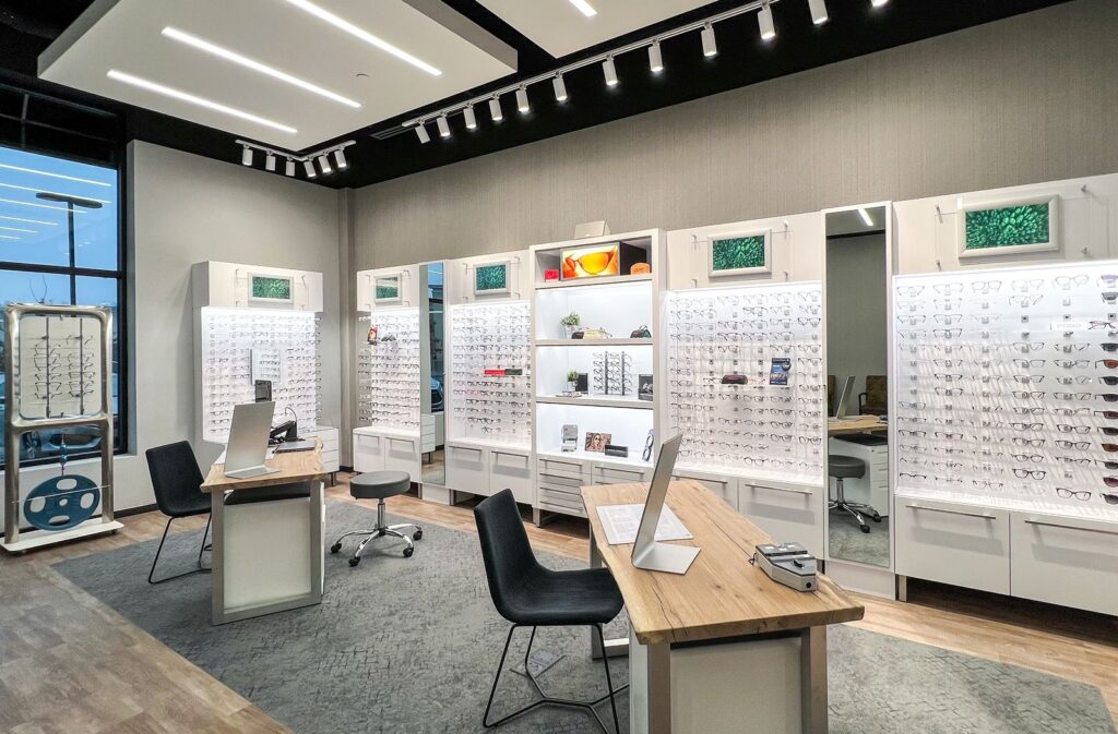 Retail eyewear display area featuring custom shelving and modern optometry office design near Indianapolis.