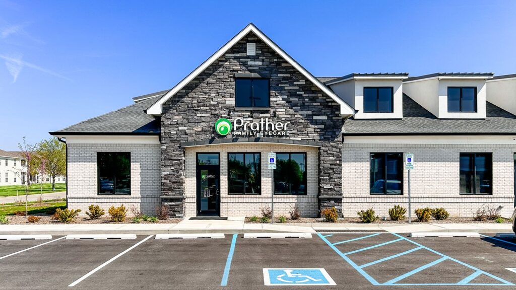 Exterior view of Prather Family Eyecare building with stone façade and pitched roof.