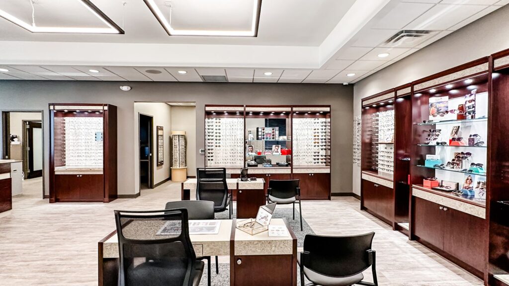 Optical exam area with modern lighting and eyewear displays.