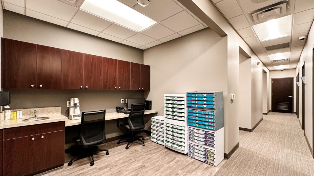 Staff workspace with modern cabinetry and computer stations.