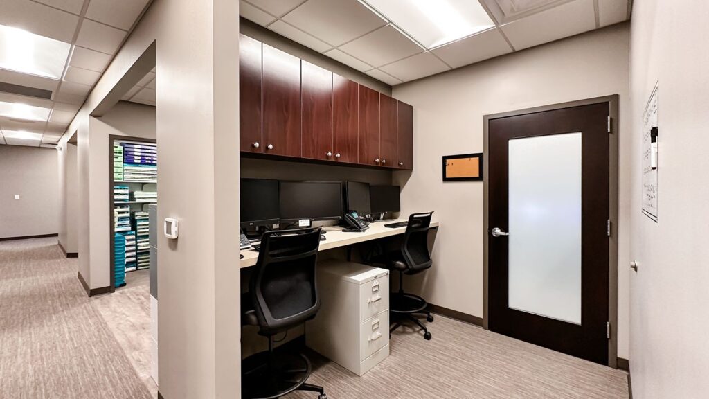 Healthcare interior design with durable flooring and workspace organization.