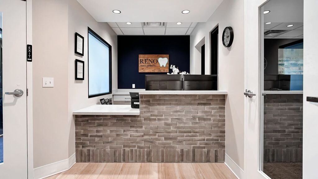 Hallway leading to treatment rooms in a modern dental office.