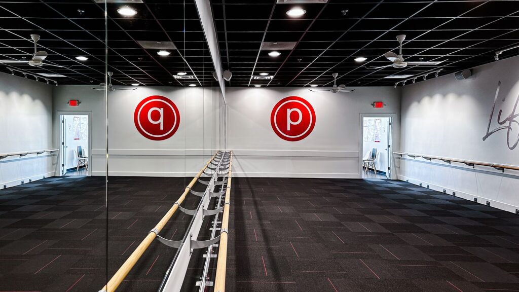 Barre studio with natural lighting and modern wellness interior design.