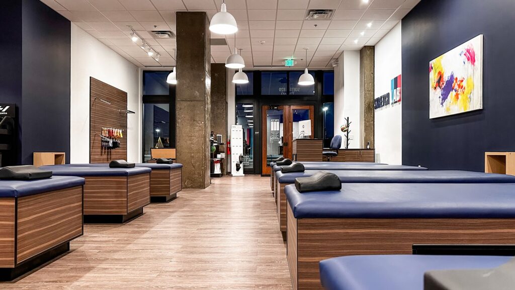 Reception area with StretchLab logo and wood-accented front desk.