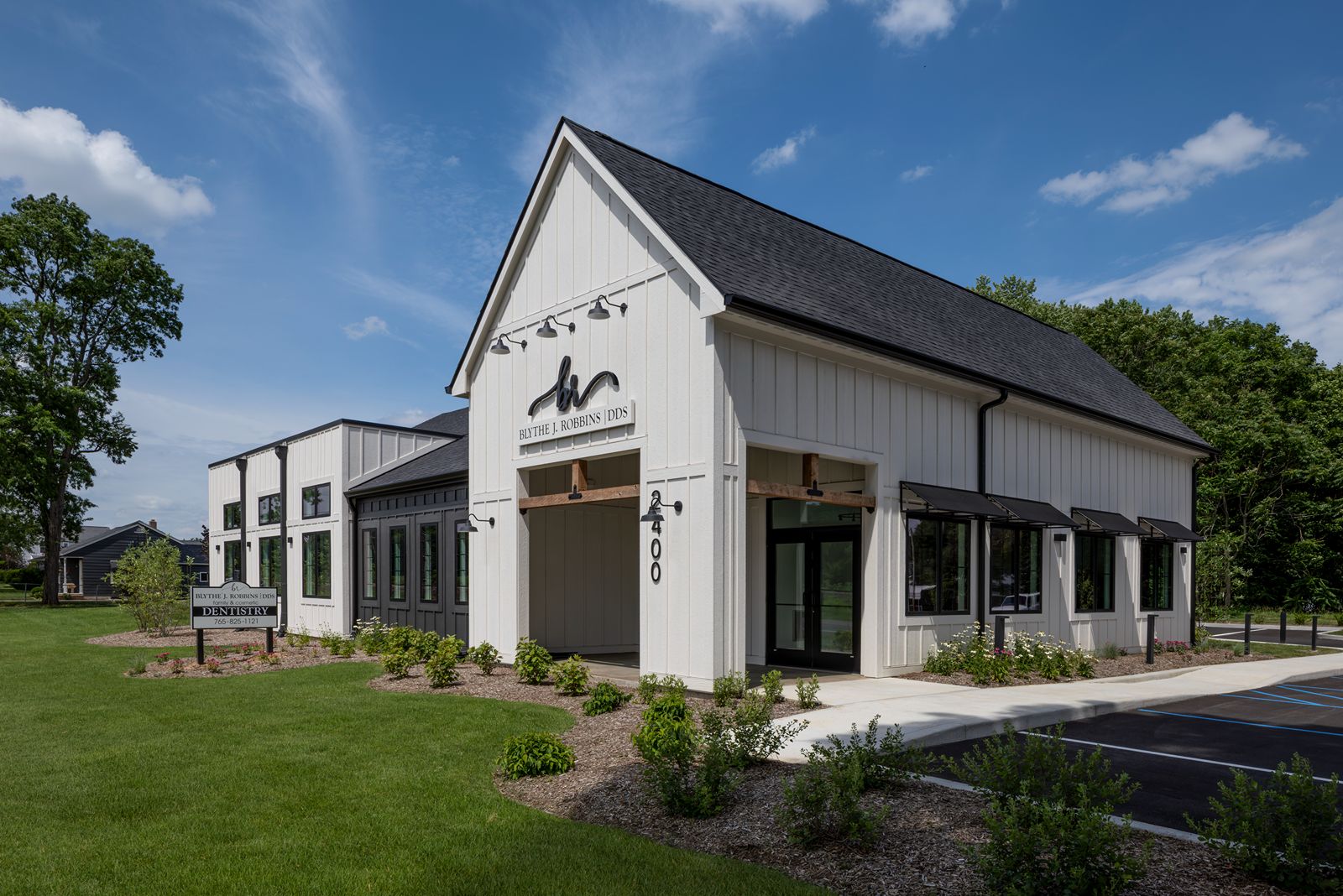 Exterior of Blythe J. Robbins DDS dental office featuring modern farmhouse architecture and dental office design in Indiana.