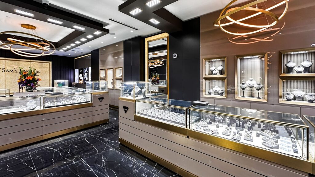 Store interior with illuminated product displays and gold accents.