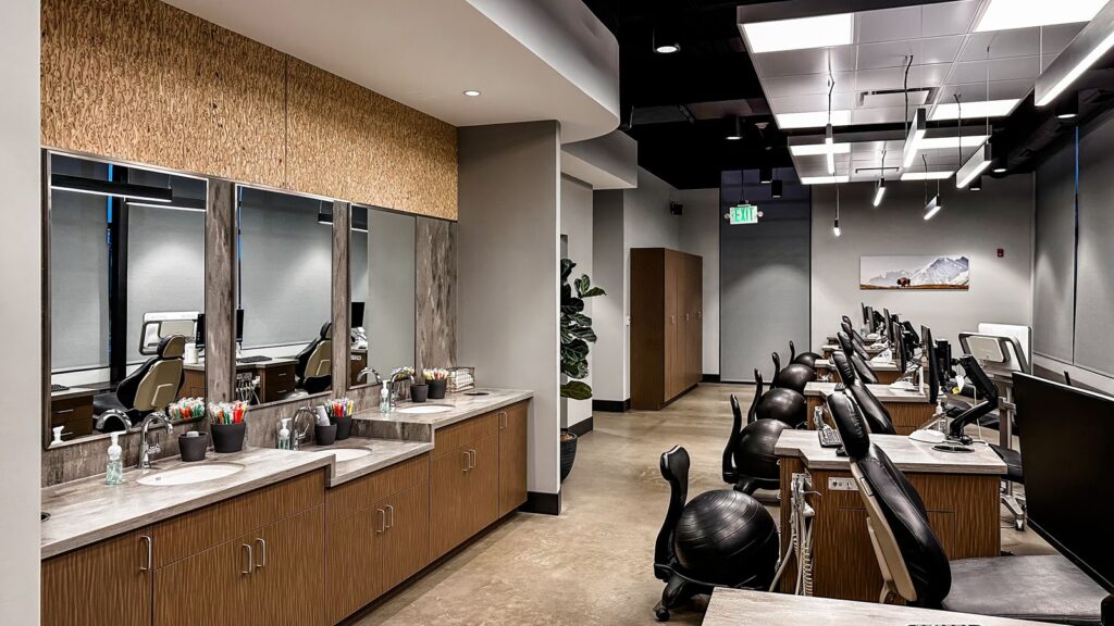 Row of dental chairs highlighting modern orthodontic architecture and patient-centered design.