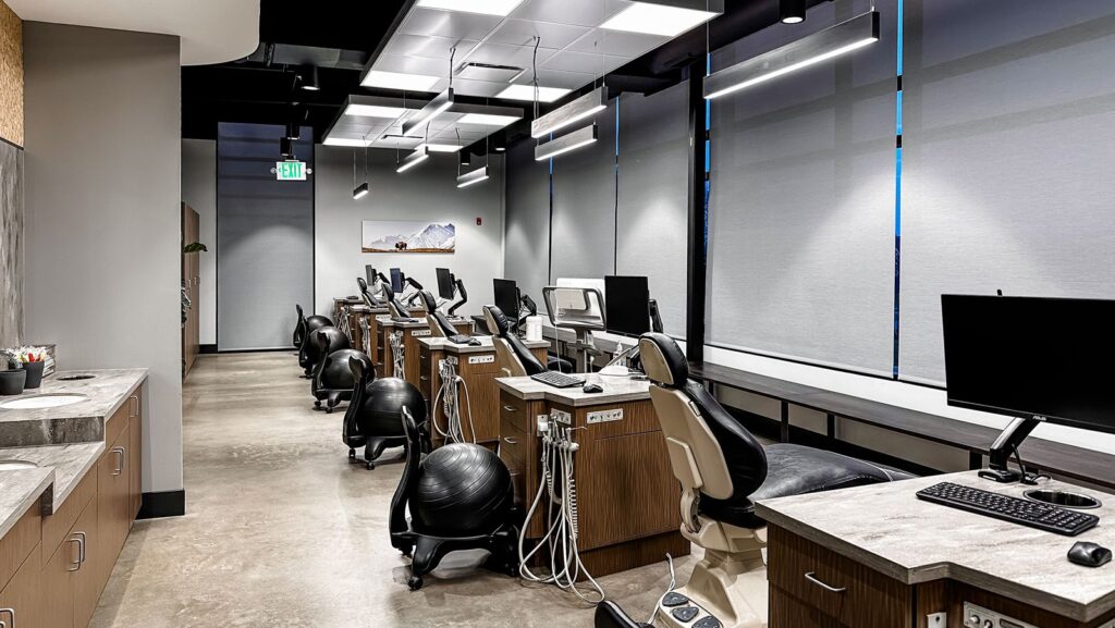 Open treatment area showcasing warm materials and contemporary healthcare interior design.