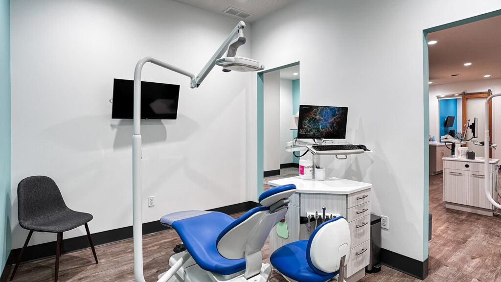 Exam room featuring dental equipment and clean modern interior.