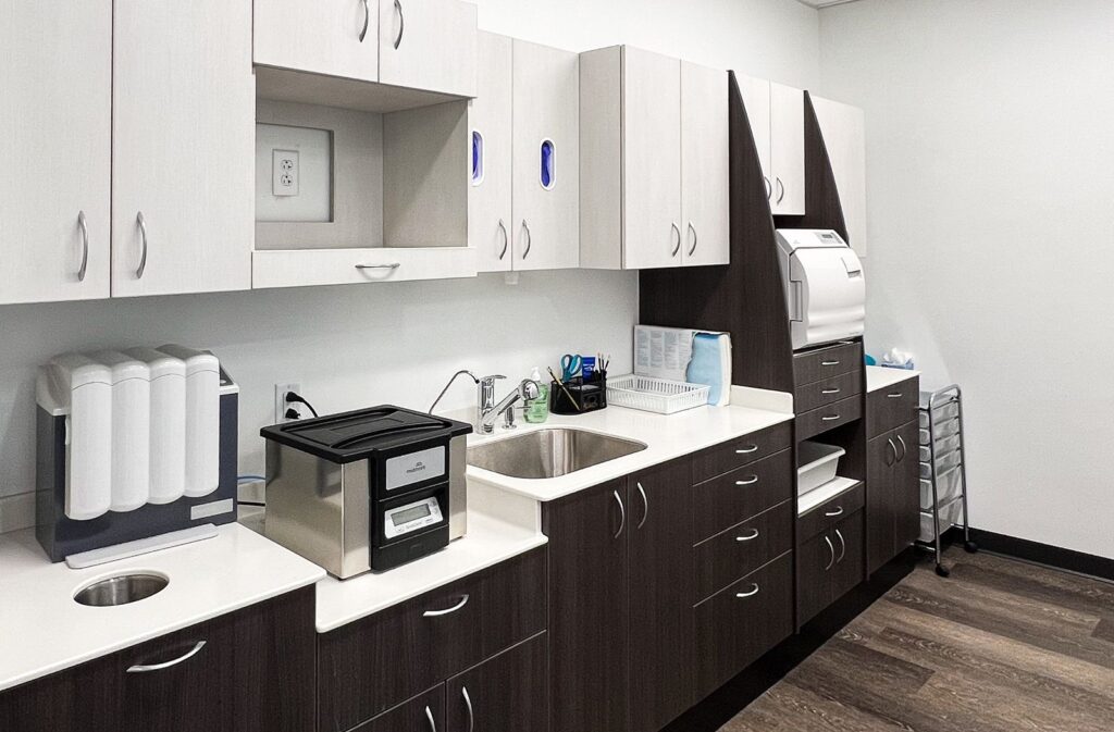 Sterilization room with built-in cabinetry and clean, functional orthodontic office layout.