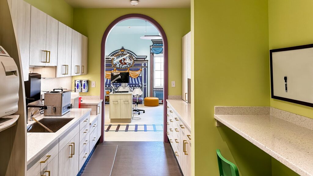 Colorful hall and doorway design reflecting playful pediatric dental clinic interior decoration.