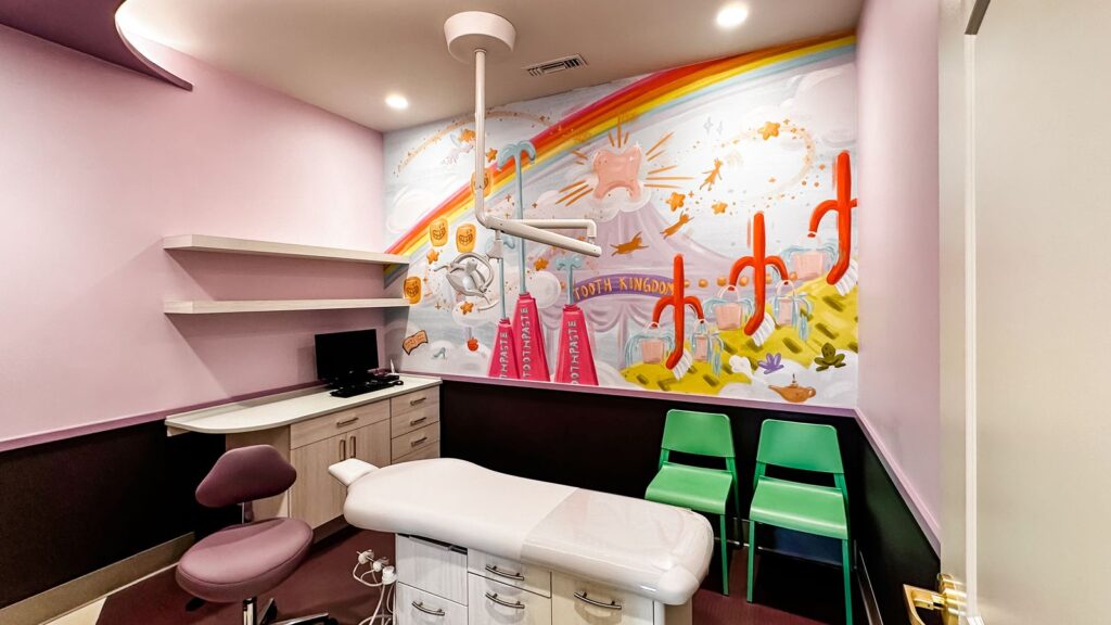 Hallway mural of trees and flowers showcasing interior designer Indiana artistry for pediatric dental offices.