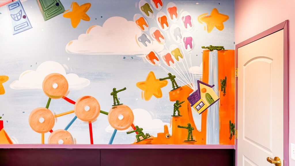 Kids’ playroom featuring colorful walls, soft flooring, and modern pediatric dental interior design.