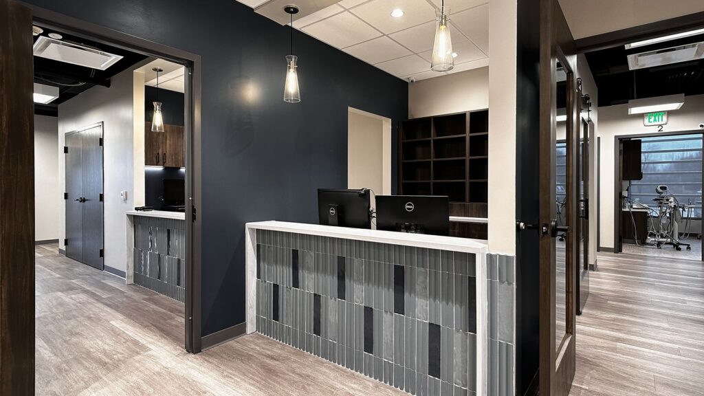 Panoramic imaging area with digital radiography equipment in updated dental implant clinic.