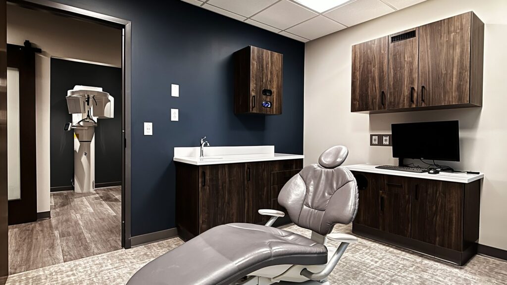 Treatment area with clean surfaces and built-in cabinetry in Indianapolis periodontal office.