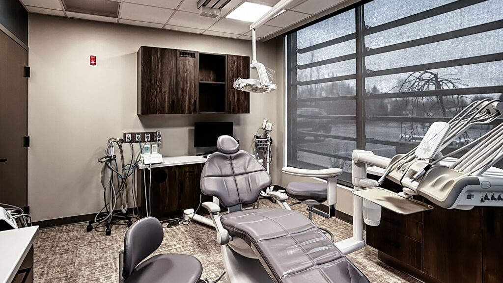 Private operatory showcasing wood finishes and digital equipment setup.