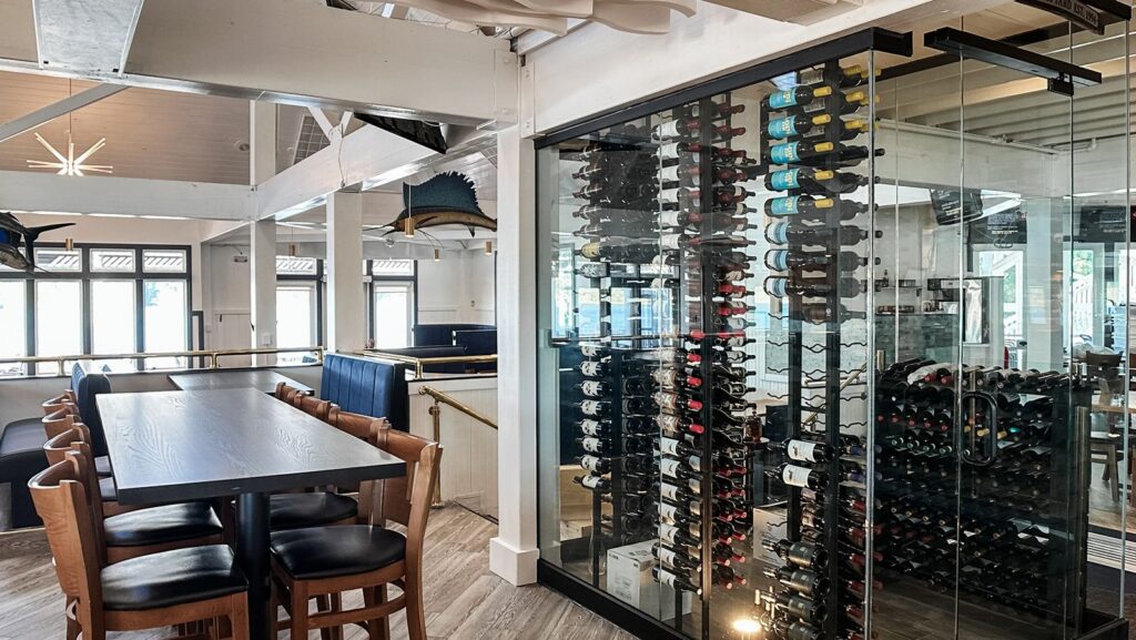 Dining area featuring relocated wine cellar and bar space.